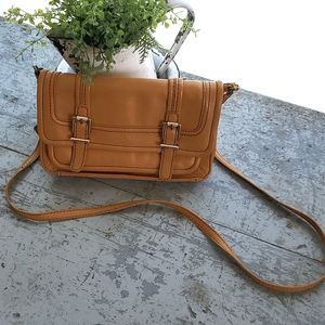 The SAK Leather Cognac/ Gold Cross body purse.